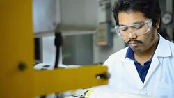 close-up panning: young engineer concentrate to make plastic bag fiilm Stock Footage