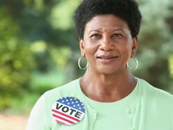 MS Portrait of Senior Woman Wearing VOTE Button / Richmond, Virginia, USA Stock Footage
