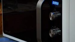 Cooking using a microwave Stock Footage