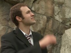 Business man takes a break from climbing Stock Footage