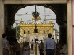 MS Bell hanging above the walkway to Golden Temple / Amritsar, Punjab, India Stock Footage