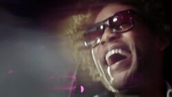 Hip-hop star laughs and waves to fans from back of limousine at awards show Stock Footage