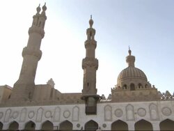 Wide Shot, static - Sunlight illuminates the towers of a mosque / Egypt Stock Footage