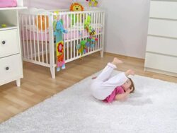 HD CRANE: Baby Girl Kicking With Her Legs Stock Footage