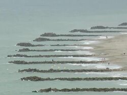 WS AERIAL View of people swimming on Groynes beach at Frontignan / Languedoc Roussillon, France Stock Footage