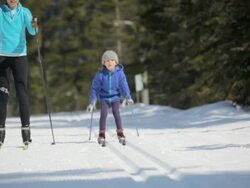 MS Mother skiing with her girl on icy landscape / Whistler, BC, Canada   Stock Footage