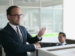 MS two businessmen in discussion at workstation in office/Seattle, Washington, USA Stock Footage