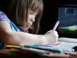 Little Girl Coloring a Picture Stock Footage