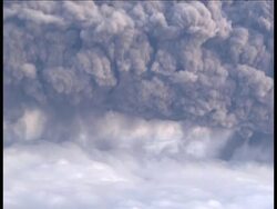 Aerials of plume of ash spewing from volcano News Clip
