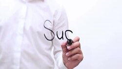 Hand Writing 'Success' Stock Footage
