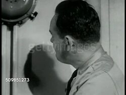 Officers listening to air battle Instructional Video