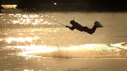 HD Super Slow-Mo: Wakeboarder Jumping At Sunset Stock Footage