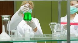Mature chemical scientists working in laboratory Stock Footage