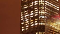 Night to Day timelapse of an office, with Office Lights gradually switching on Stock Footage