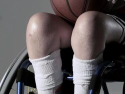 Boy basketball player in wheelchair with basketball Stock Footage