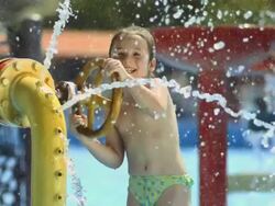 HD Super Slow-Mo: Portrait Of Little Girl Splashing Water Stock Footage
