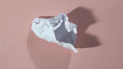 paper ball unwrapping HD Stock Footage