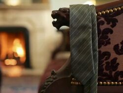 Tie hanging on armchair Stock Footage