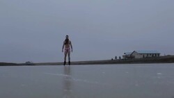 Young man on frozen pond in winter in rural Montana, USA. Stock Footage