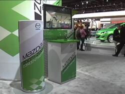 Mazda Zoom-Zoom Concentrate soda display montage Stock Footage