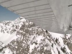 AERIAL WS View of Rocky Mountains and airplane wing out of small aircraft / Flathead, Montana, USA Stock Footage