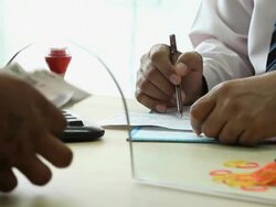 Man depositing money at bank counter, Delhi, India Stock Footage