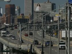 A urban landscape of the BQE Brooklyn Queens expressway in Queens Manhattan is featured behind Stock Footage