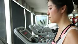 sport women running on treadmill cardio equipment Stock Footage