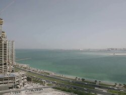 WS HA View over building under construction and beach / Doha, Qatar Stock Footage