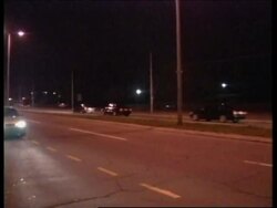 Motorcade of vehicles carrying Milosevic leaves Belgrade compound for prison. News Clip