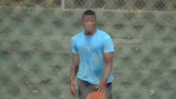 A young man basketball player dribbling before passing the ball to a teammate. - Slow Motion Stock Footage