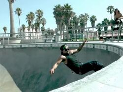 MS SLO MO Shot of skateboarder riding up out of bowl, grinding, and riding back down / Venice, California, United States Stock Footage