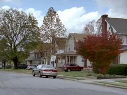 MS view of Three story upper middle class houses and dark car midway thru away / Philadelphia ,Pennsylvania,United States Stock Footage