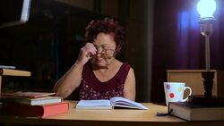 Grandmother reading a book Stock Footage