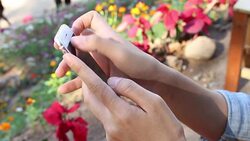 Woman play mobile Stock Footage