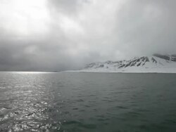 Breathtaking arctic landscape seen from a sailing boat on Isfjorden on the Spitsbergen island, Svalbard Archipelago, Norway; cloudy stormy weather Stock Footage