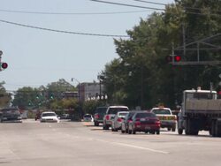 Cargo Train Passing At Level Crossing News Clip