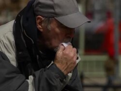 Economically Distress Man Coughs in Urban Setting Stock Footage