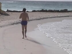 Jog on the Beach Stock Footage