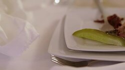 MEDIUM SHOT PANNING Pickle and meat on plate Stock Footage