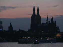 WS View of Cologne skyline at dusk (Town Hall, Cathedral, Great St. Martin church, Deutzer Bridge) / Cologne, North Rhine Westphalia, Germany    Stock Footage