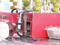 Street vendor preparing lemon water for his customer, Delhi, India Stock Footage