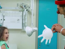 Clown  amuses the girl in hospital Stock Footage