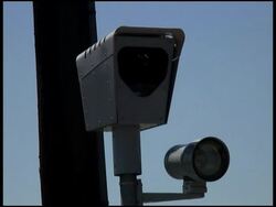 Cars Reflected in Red Light Traffic Surveillance Camera Stock Footage