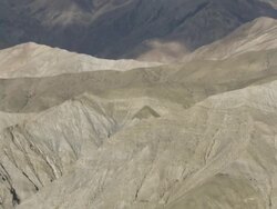 WS PAN View of Tibet valley and village surrounding arid mountains / Saldang village, High Himalayas, Upper Dolpo near Tibetan border, Nepal  Stock Footage