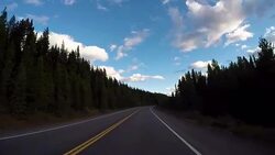 POV from car as it dives along mountain road Stock Footage