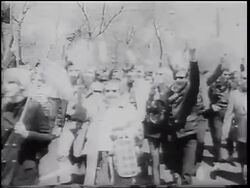 B/W 1967 crowd carrying American flags + making peace/victory signs walking in parade / NYC Stock Footage