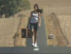 Young woman carrying suitcase, Cape Town, South Africa Stock Footage