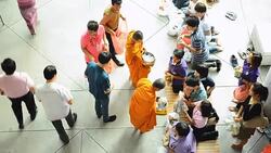 top view: Buddhist monks collecting alms and offerings in new year event Stock Footage