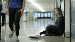 Young adult females bullying another student at school Stock Footage